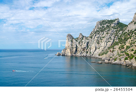 Pleasure boat floating in the water of the bay 26455504