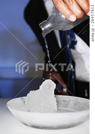 Cold water turn to ice in cold glass plate 26457813