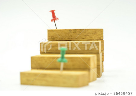 red pin on wood block step on isolate background red pin on wood block step on isolate background 26459457