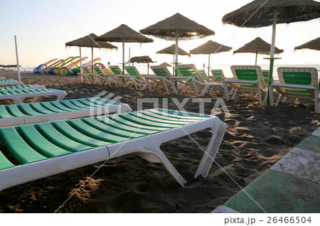 Beach lounge chair and beach umbrella , Spain 26466504