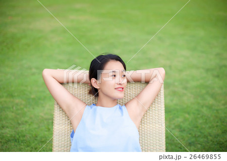 Girl relaxing on a recliner chair 26469855