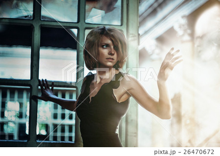 girl in a dress in an old house 26470672