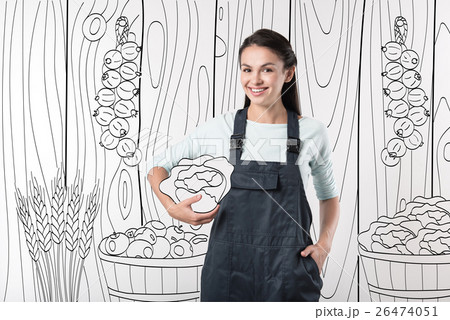 Cheerful farmer woman holding a cabbage Cheerful farmer woman holding a cabbage 26474051