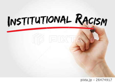 Hand writing Institutional racism with marker 26474917