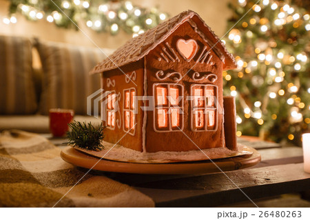 Homemade gingerbread house on background room Homemade gingerbread house on background room 26480263