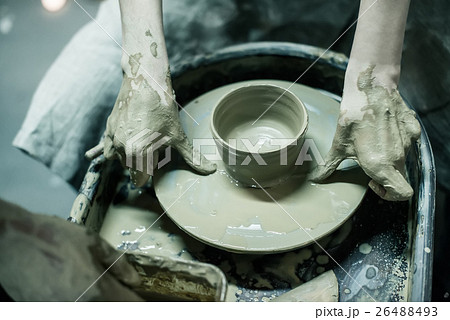 Hands working on pottery wheel Hands working on pottery wheel 26488493
