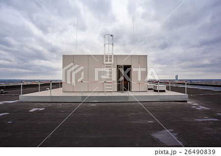 on the roof of a tall building on the roof of a tall building 26490839