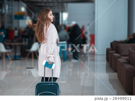 Traveller walking the airport hall. 26499011