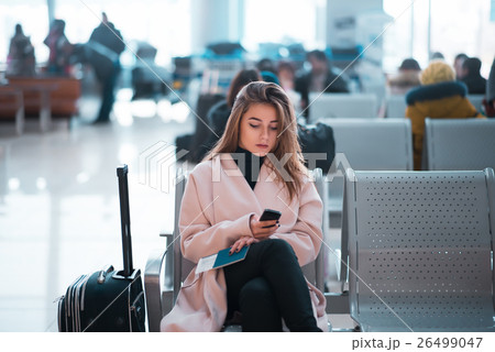 Airport business woman waiting in terminal. Airport business woman waiting in terminal. 26499047