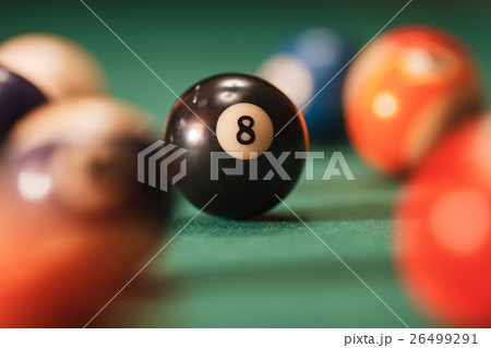 Pool ball with number 8 over green background. Pool ball with number 8 over green background. 26499291