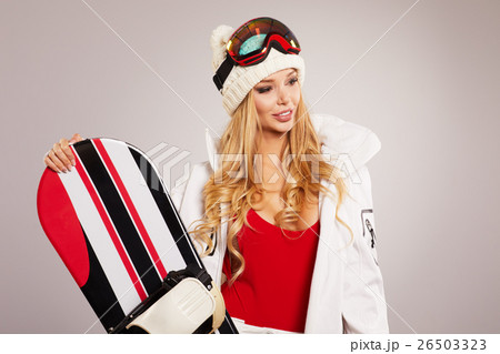 attractive sexy woman standing holding snowboard attractive sexy woman standing holding snowboard 26503323