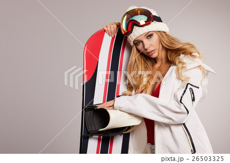 attractive sexy woman standing holding snowboard attractive sexy woman standing holding snowboard 26503325