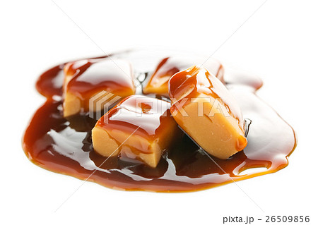 Caramel candies with caramel sauce. 26509856