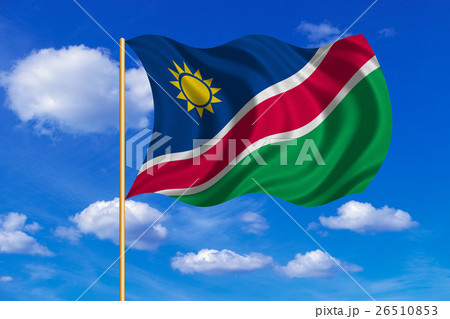 Flag of Namibia waving on blue sky background 26510853
