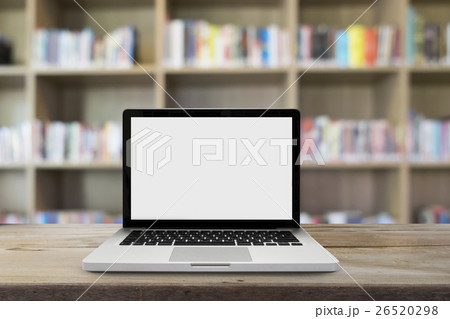 Open empty white screen laptop on wooden table Open empty white screen laptop on wooden table 26520298