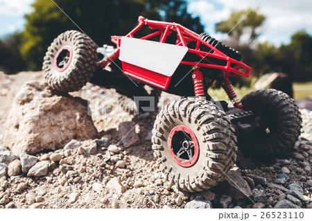 Toy crawler overcoming rock close-up Toy crawler overcoming rock close-up 26523110