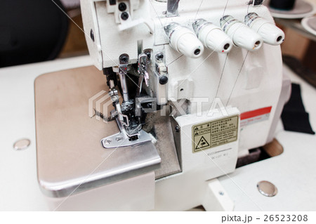 Overlock sewing machine in tailor office close-up 26523208