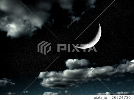 The moon in the night sky in clouds 26524750
