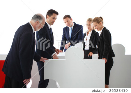 Business people and puzzle Business people and puzzle 26528450