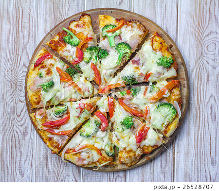 Italian Pizza top view on wood background 26528707