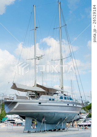 Sailboat in a shipyard for maintenance with other Sailboat in a shipyard for maintenance with other 26529184