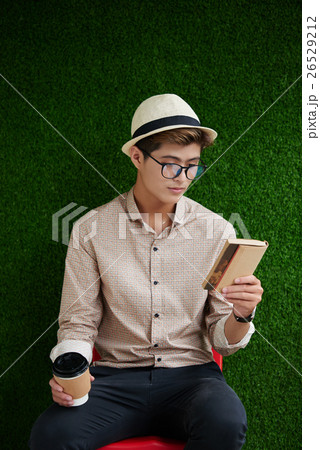 Enjoying a book Enjoying a book 26529212