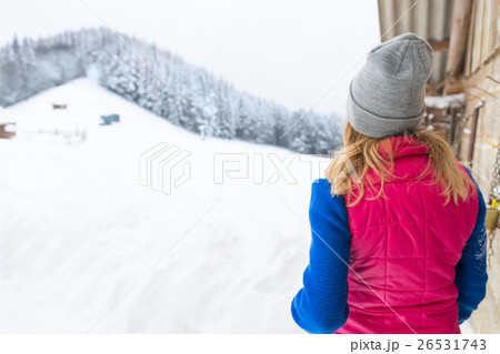 Young Girl Looking At Snowy Winter Forest Village Young Girl Looking At Snowy Winter Forest Village 26531743