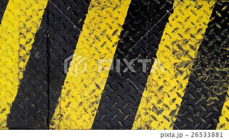 Black and yellow line paint on non-slip background 26533881