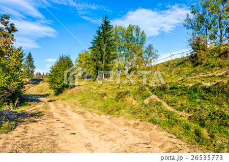 path on hillside meadow in mountain 26535773