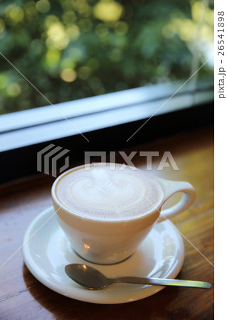 cappuccino coffee on wood background cappuccino coffee on wood background 26541898