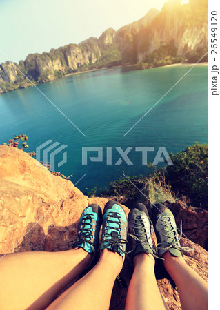 two rock climbers legs at seaside mountain rock 26549120
