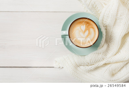 Winter cappuccino coffee cup on white wood Winter cappuccino coffee cup on white wood 26549584