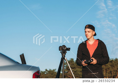 Young photographer piloting drone, free space Young photographer piloting drone, free space 26550234