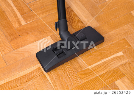 Vacuum cleaner on parquet 26552429