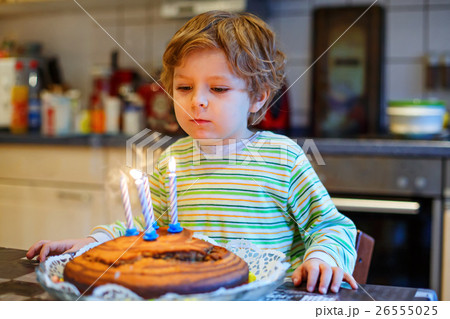 Little kid boy celebrating his birthday and 26555025
