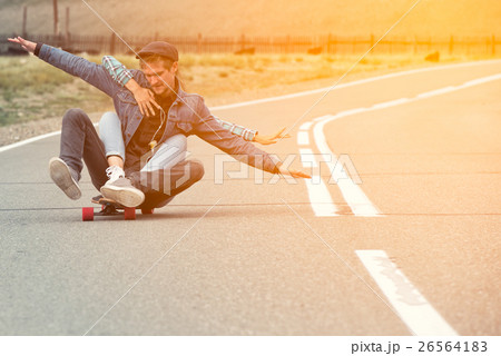 The guy with the girl drive to longboard on a The guy with the girl drive to longboard on a 26564183