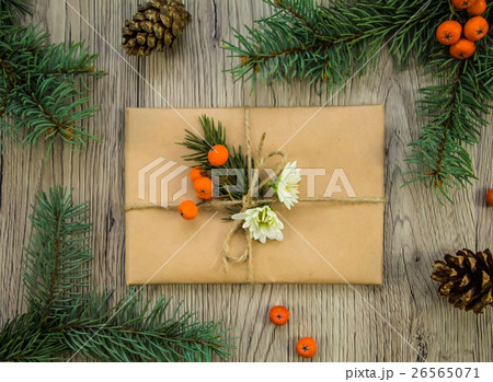 Christmas box with natural decoration, flat lay Christmas box with natural decoration, flat lay 26565071
