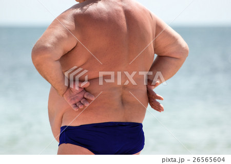 Back view of overweight man. Back view of overweight man. 26565604