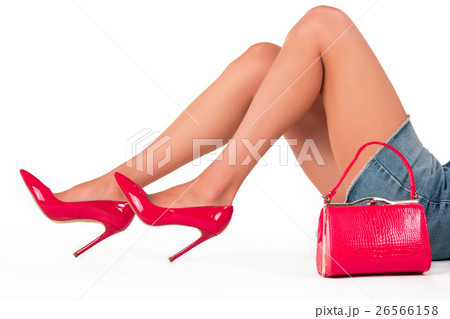 Handbag and legs in heels. Handbag and legs in heels. 26566158
