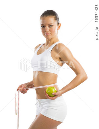 young athletic woman measuring waist young athletic woman measuring waist 26574428
