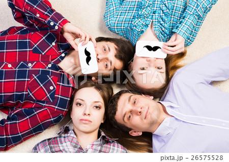 four young men lie together 26575528