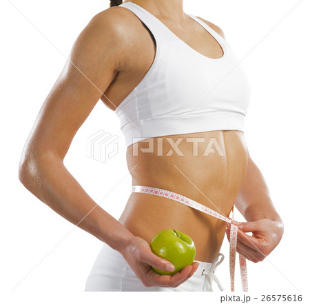 young athletic woman measuring waist 26575616