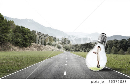 Businesswoman inside light bulb 26575883