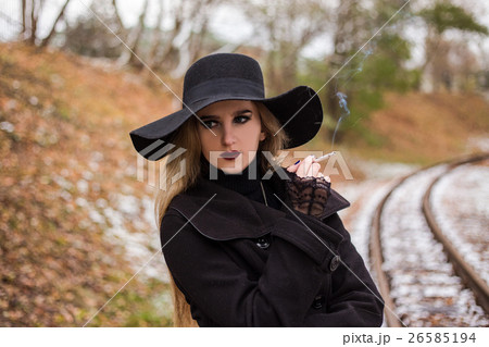 Young woman smoking a cigarette 26585194