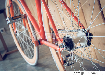 fixed gear bicycle parked with wood wall 26587100