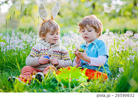 Two little boy friends in Easter bunny ears during Two little boy friends in Easter bunny ears during 26590632