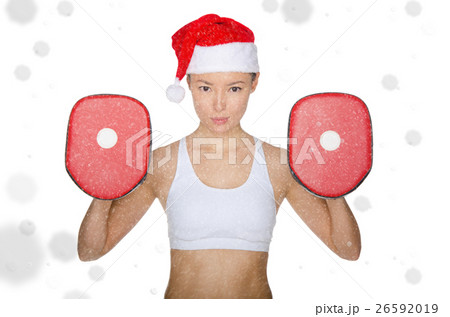 Asian girl holding implements for martial arts in snow Asian girl holding implements for martial arts in snow 26592019
