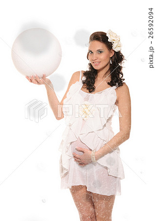 Beautiful pregnant woman with ball in snow 26592094