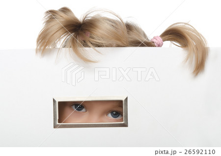 little girl looks inquisitively out of box little girl looks inquisitively out of box 26592110