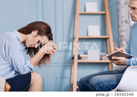 Troubled woman talkign with professional Troubled woman talkign with professional 26593346